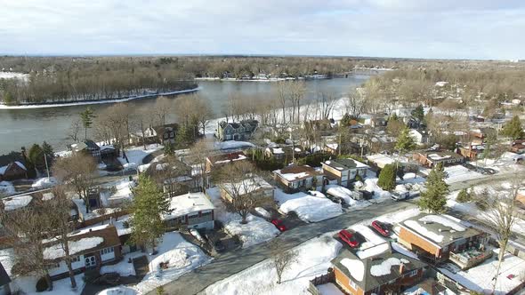 Aerial view of a snow-covered neighborhood in a residential area of Canada.