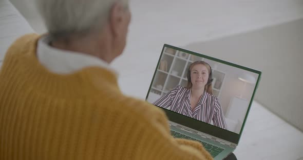 Online Consultation for Elderly Person Staying Home During Pandemic Time, Woman Is Calling To Old