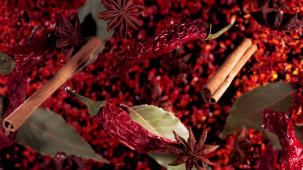 Super Slow Motion Shot of Flying Mix Spices in Black Background