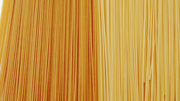 Raw spaghetti on white background