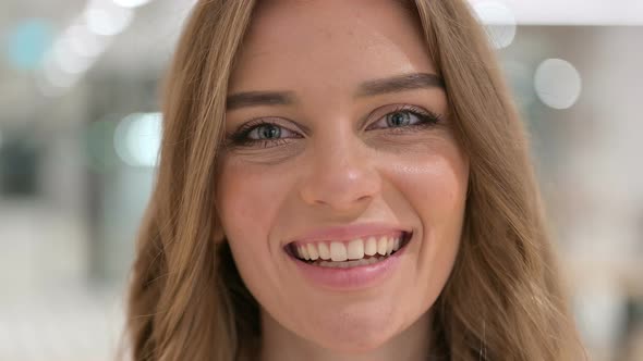 Close Up of Face of Woman Smiling at the Camera