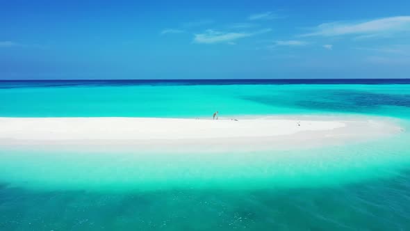 Aerial view scenery of relaxing seashore beach time by clear sea with bright sandy background of a d