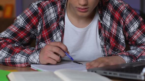 High School Student Preparing to Exams at Night, Hardly Studying, Close Up