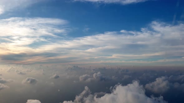 Flying over beautiful clouds. View from airplane window