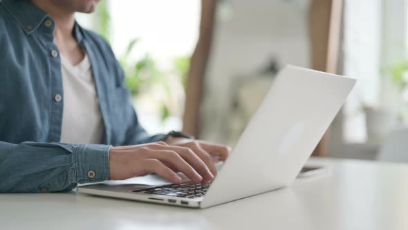 Hands of Man Typing on Laptop