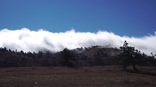 Aerial View of Thick Fog Like Beautiful Ocean of Clouds and Mountain Peaks Above Clouds