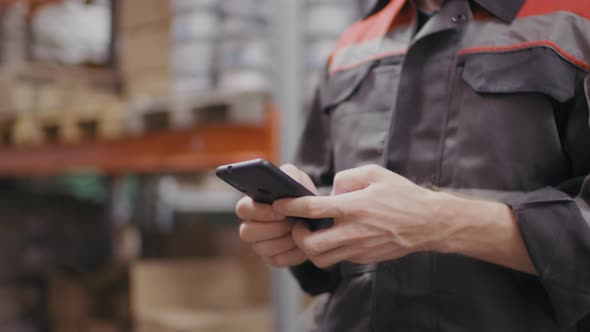 Male Construction Worker With Smartphone