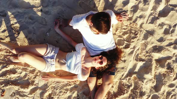 Happy Couple on Romantic Honeymoon Have Fun on Beach on White Sand