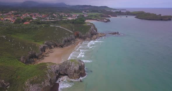 Rocky cliff shoreline of Asturias, north Spain. Off season, cloudy day