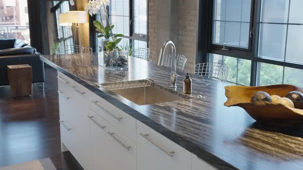 Modern Kitchen Sink on a dark countertop in a Modern Home