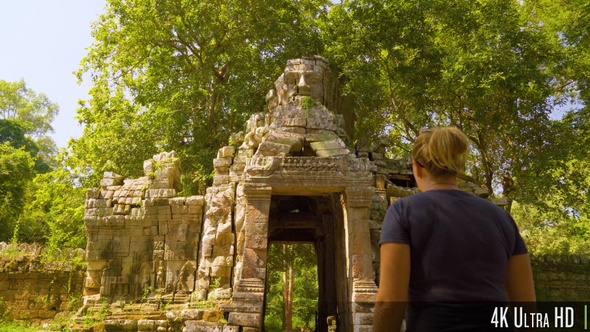 4K Tourist Woman Exploring Khmer Empire Tower Ruins in Cambodia