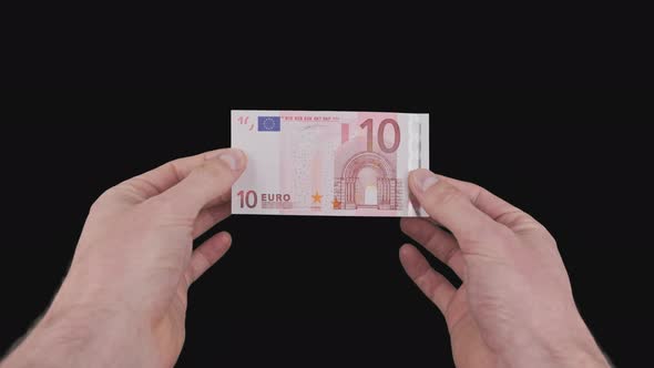 Male Hands Show a Banknote of 10 Euro with Alpha Channel