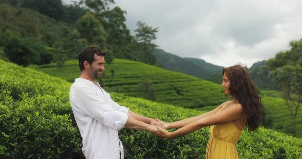 Couple of Travelers in Love in Front of Nature Background Tea Plantations Landscape