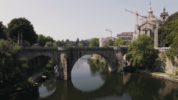 Medieval Sao Goncalo Bridge over the Tamega River, Amarante, Portugal. Aerial pullback