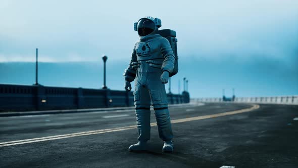 Astronaut in Space Suit on the Road Bridge alt
