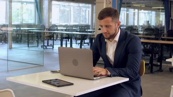 Manager Using Computer at Work