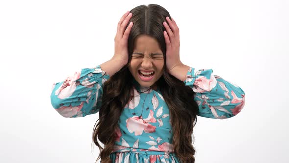 Unhappy Irritated and Stressed Kid Shouting and Hold Head Because of Headache Stress