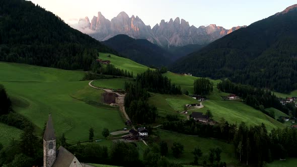 Aerial Drone video of Santa Magdalena St Maddalena Val di Funes in Dolomites Italian Alps