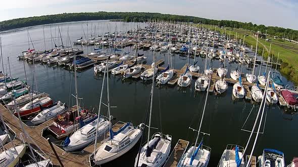 Aerial footage of sailboat marina.