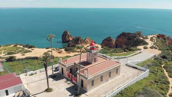 Red Lighthouse at the end of the Ponta da Piedade in Lagos, Algarve, Portugal