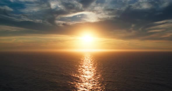 Sun Setting Over Horizon of Atlantic Ocean