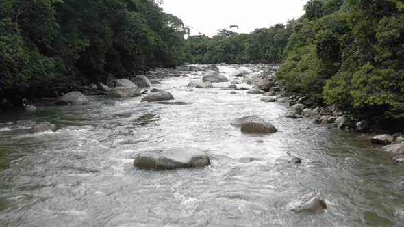 Tropical river in the Andes of Ecuador with large boulders