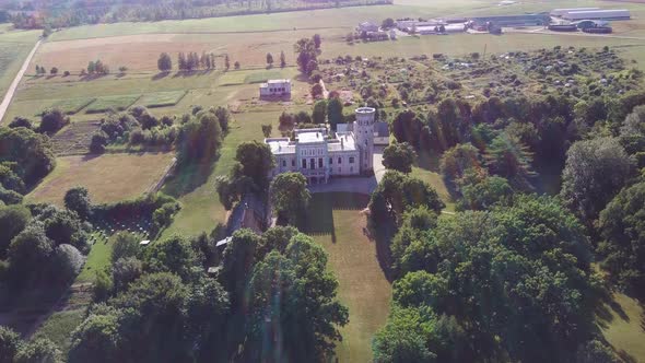 Vecauce Manor in Latvia Aerial View of the Pink Castle Through the Park. Vecauce Castle Tower With a