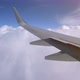 Wing of an Airplane Flying Above the Clouds - VideoHive Item for Sale