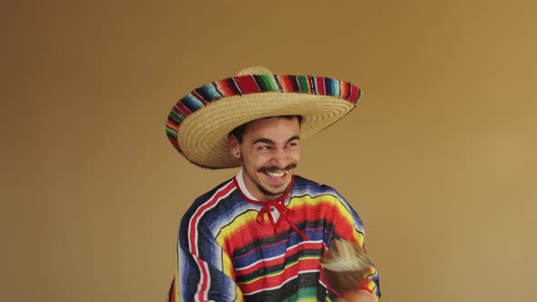 Young Mexican With Moustache Isolated On Yellow