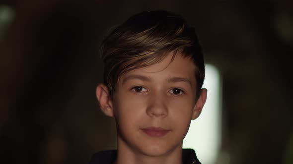 Portrait of a Boy with an Open Heart Looking at the Camera Indoors