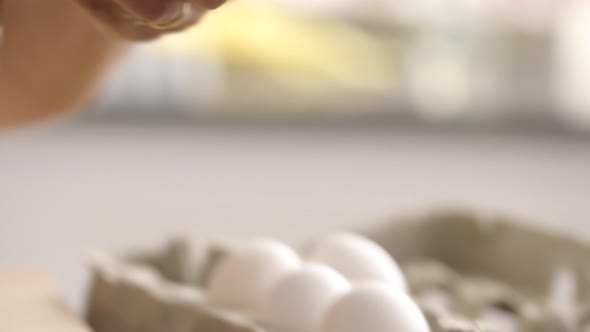 Cracking egg into mixing bowl alt