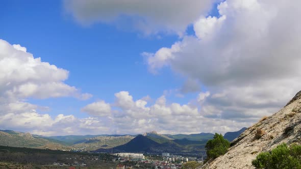 Genoese Fortress Sudak Crimea Mountains Against the Blue Sky with White Clouds