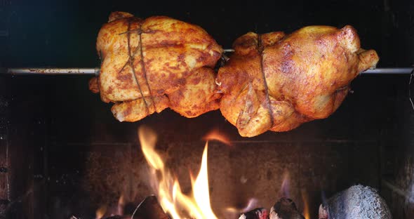 chicken roasting on a spit