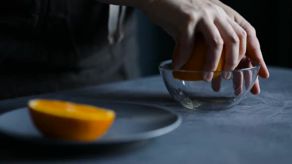 Woman Squeezing Fresh Orange Juice