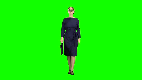Businesswoman Goes To a Business Meeting with a Case in Hand. Green Screen