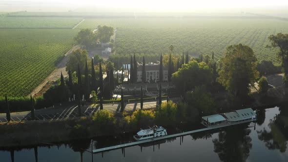 Approaching aerial of Grand Island Mansion wedding venue near Sacramento