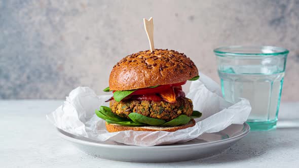 Cooking vegan lentil burger with vegetables.