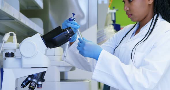 Scientist opening cap of test tube 4k