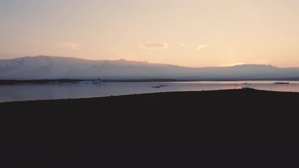 Silhouette Of Man Walking Through Icelandic Landscape