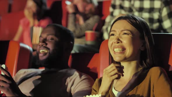 Audience Laughing at Movie Theater
