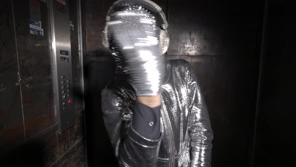 Sparkle Masked Man Dancing in a Lift