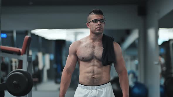 Muscular Arab in the Gym is Walking After a Workout