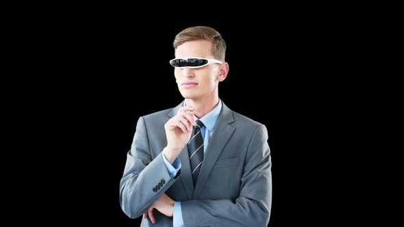 Businessman in virtual video glasses using digital screen