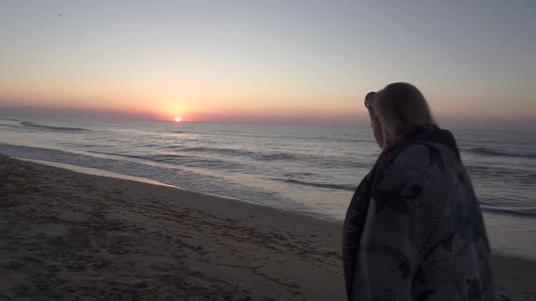 a Young Woman Walks at Dawn Along the Shore of the Black Sea