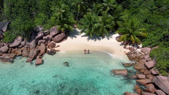 Praslin Seychelles Tropical Island with Withe Beaches and Palm Trees Couple Men and Women Mid Age on