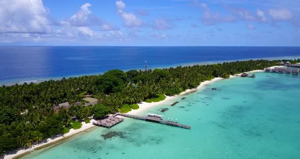 Beautiful aerial island view of a paradise sunny white sand beach and aqua turquoise water 