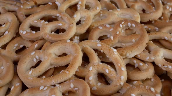 Pile of Pretzels Sprinkled with Sesame Rotate on a Turntable