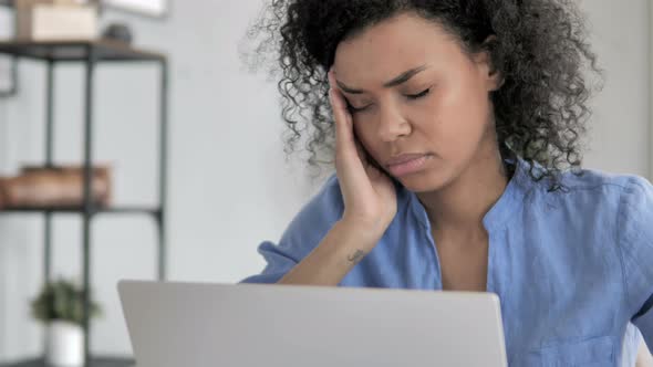 Close Up of African Woman with Headache