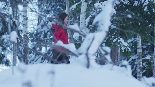Smiling woman walking in the woods alt