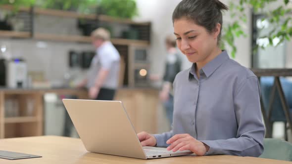 Young Indian Woman Closing Laptop Going Away in Office